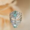 2-CT-Plume-Band-Pear-Shaped-Cyan-Blue-Moissanite-Ring-2.jpg