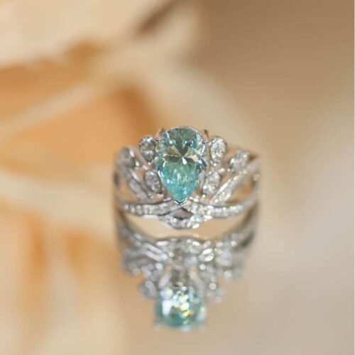 2-CT-Plume-Band-Pear-Shaped-Cyan-Blue-Moissanite-Ring-2.jpg