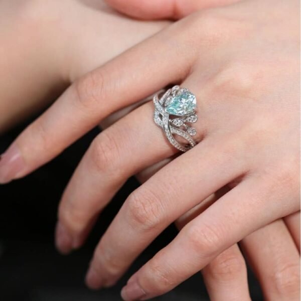 2-CT-Plume-Band-Pear-Shaped-Cyan-Blue-Moissanite-Ring-2.jpg